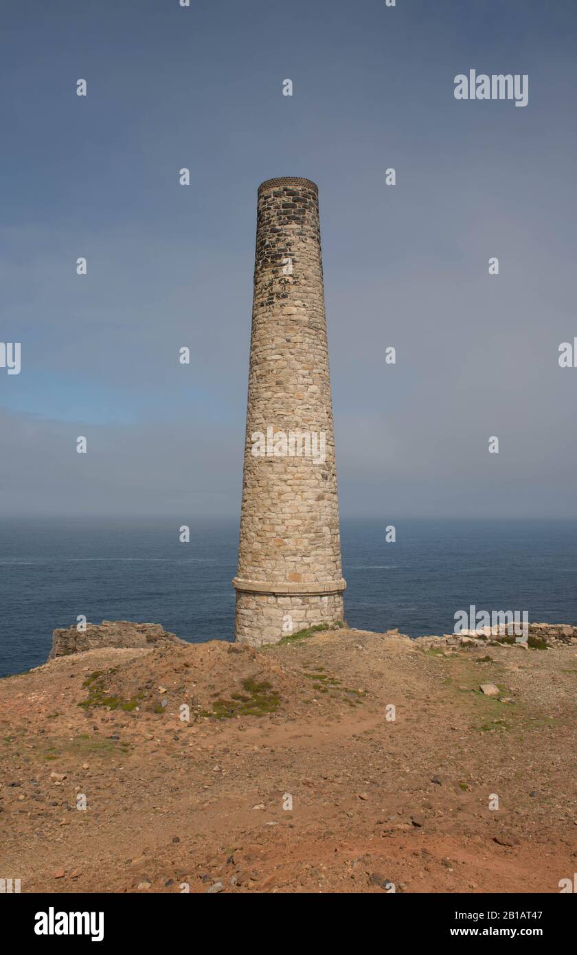 Disused Chimney on the South West Coast Path at the Abandoned Cornish Tin Mine at Geevor by the Atlantic Ocean in Cornwall,England,UK Stock Photo