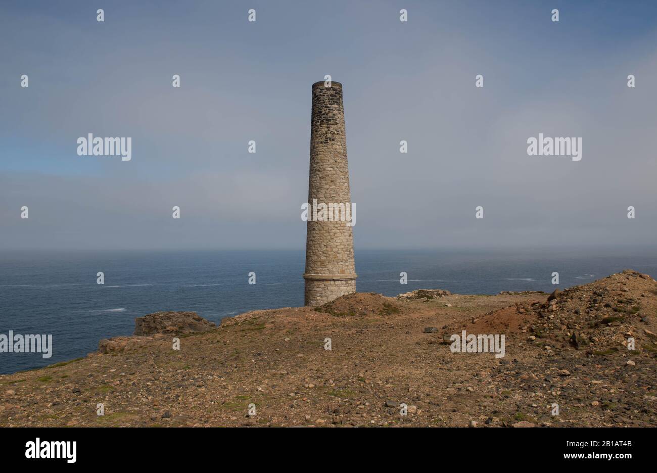 Disused Chimney on the South West Coast Path at the Abandoned Cornish Tin Mine at Geevor by the Atlantic Ocean in Cornwall,England,UK Stock Photo