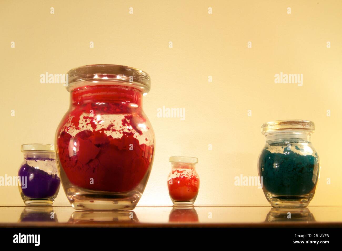 Dubai-4 Glass jar set with purple red orange and green powder on focus RGB Stock Photo