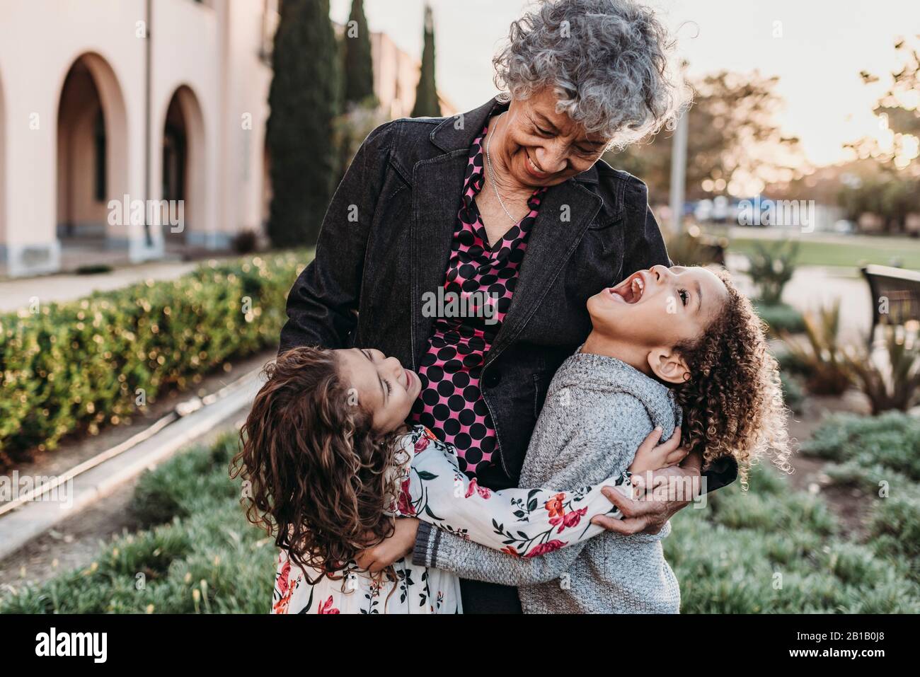 Close up lifestyle image of grandmother and grandchildren laughing Stock Photo