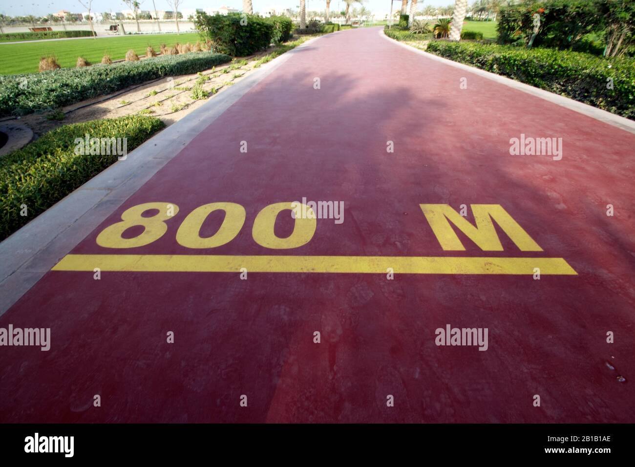 Dubai-Al Barsha Pond Park running track mark 800 M narrow Stock Photo