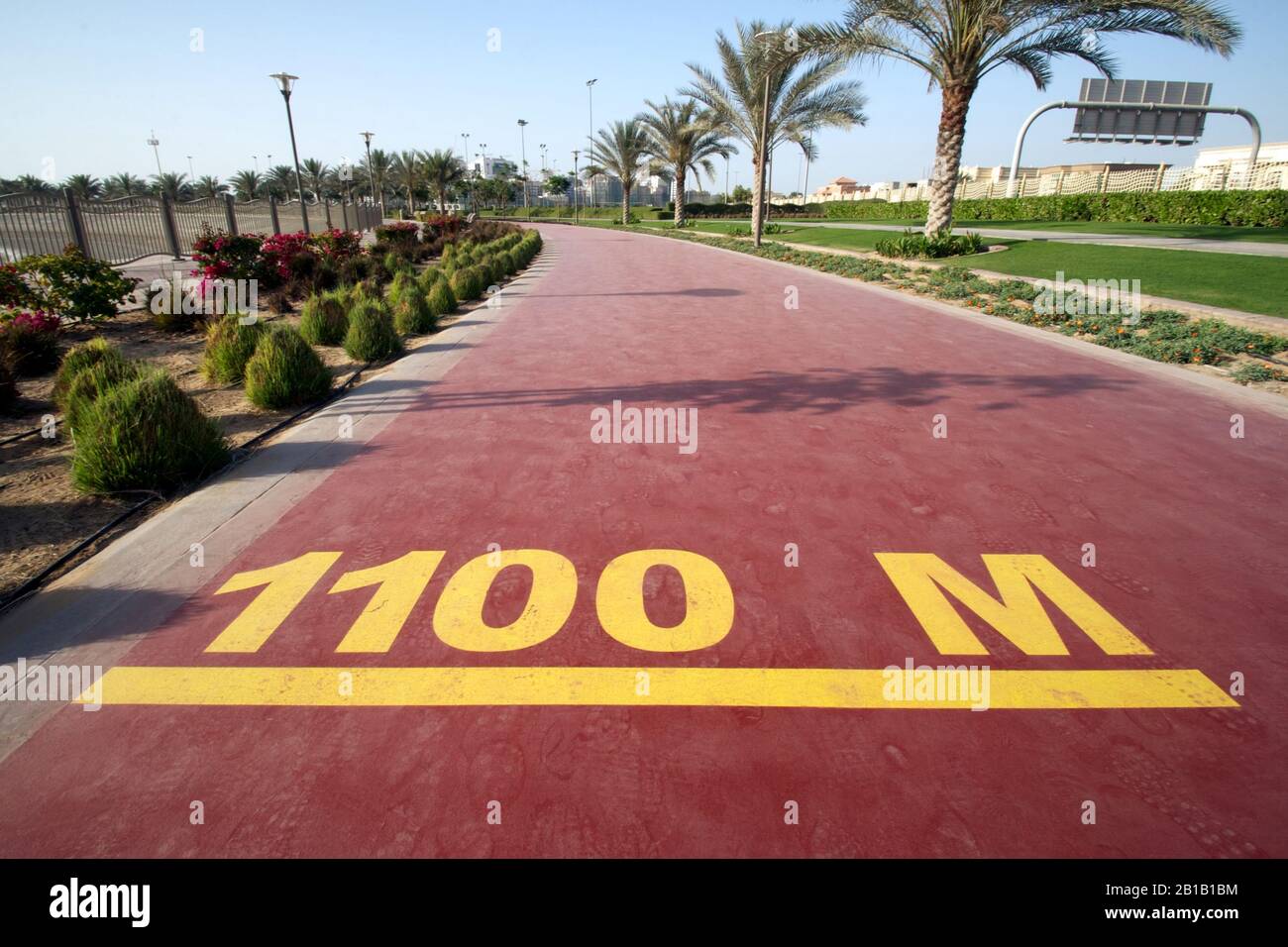 Dubai-Al Barsha Pond Park running track mark 1100 M wide Stock Photo