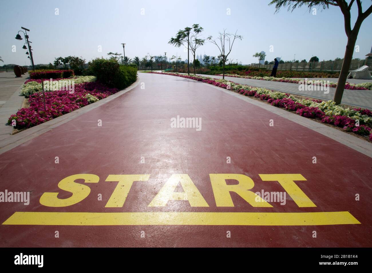 Dubai-Al Barsha Pond Park running track mark start line narrow Stock Photo