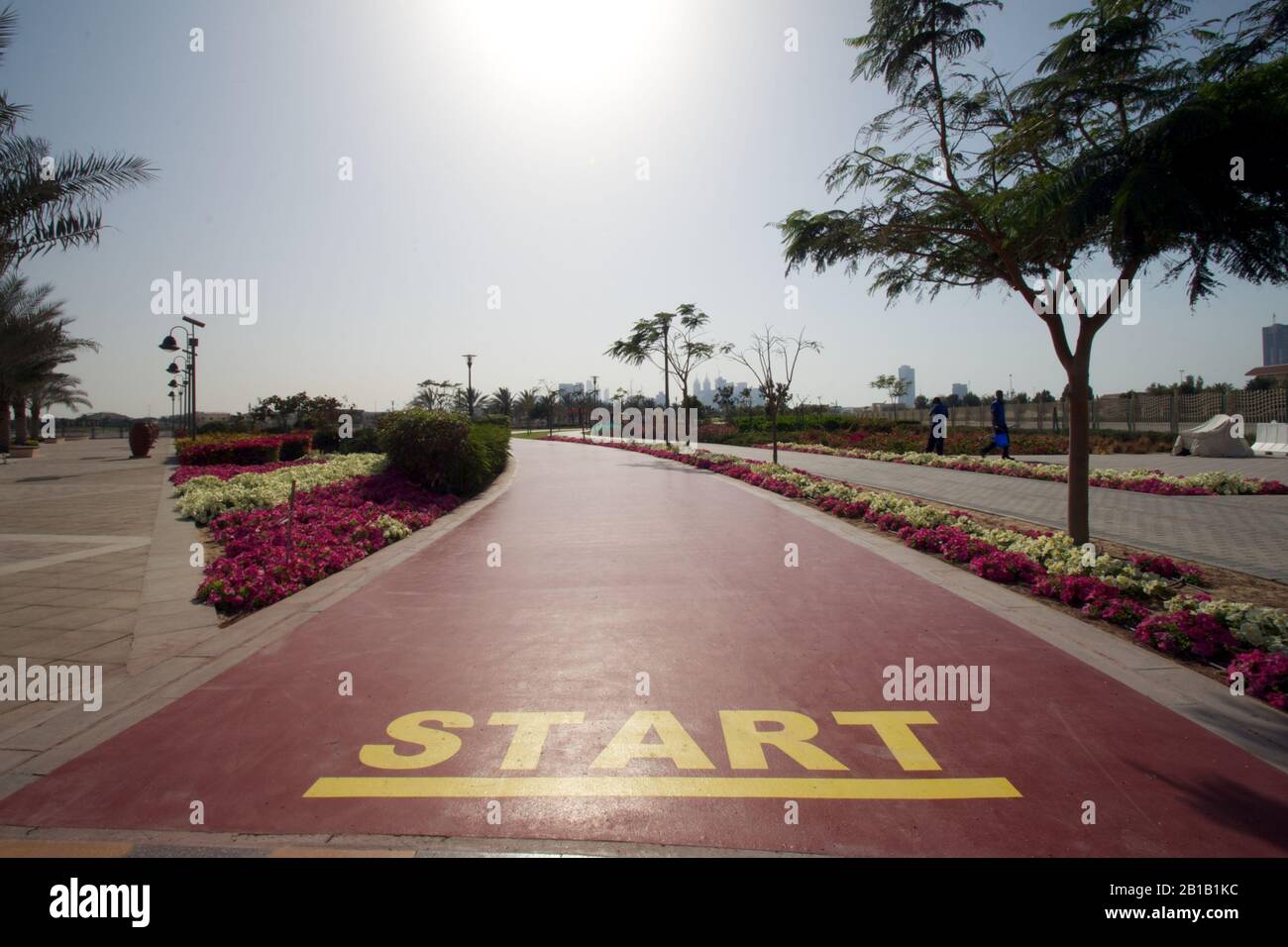 Dubai-Al Barsha Pond Park running track mark start line wide Stock Photo