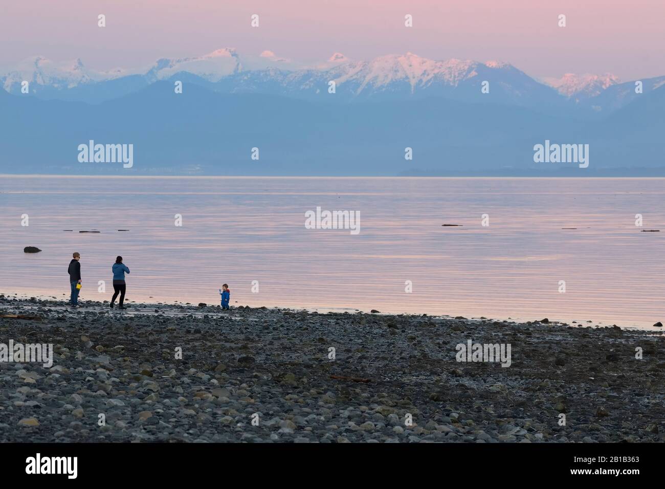 Group of people on the beach at Point Holmes, Comox Valley, Vancouver Island, B.C Canada Stock Photo