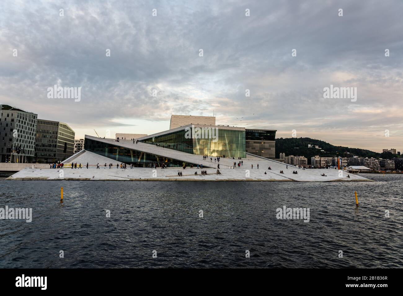 Editorial 08.31.2019 Oslo Norway Low angel view of the spectacular Opera House by the water in the sunset Stock Photo