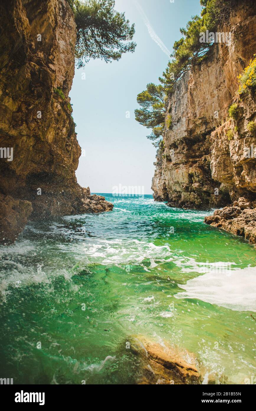 view of sea bay between rocks Stock Photo - Alamy