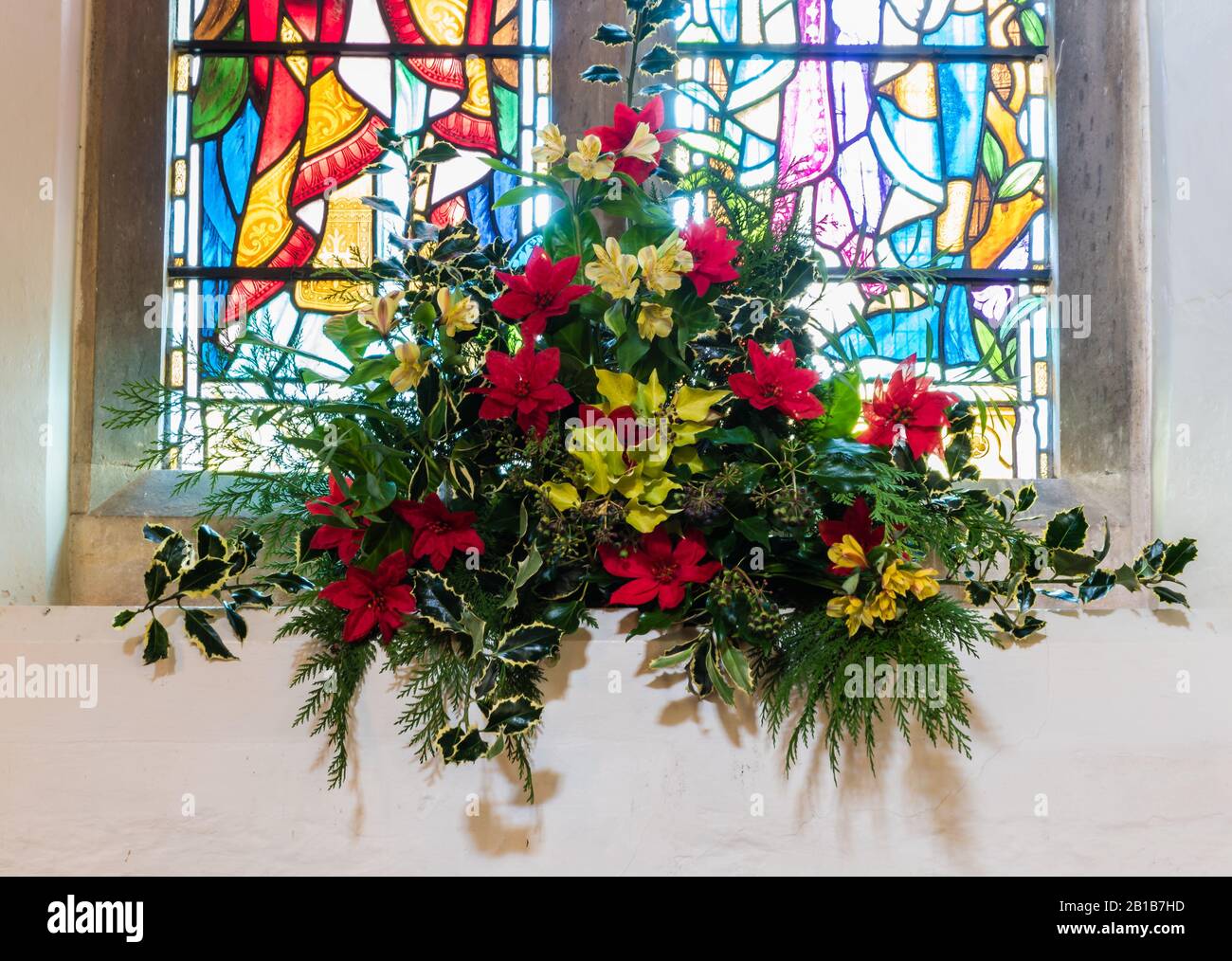 Christmas flower display at All Saints Church in East Budleigh. Stock Photo