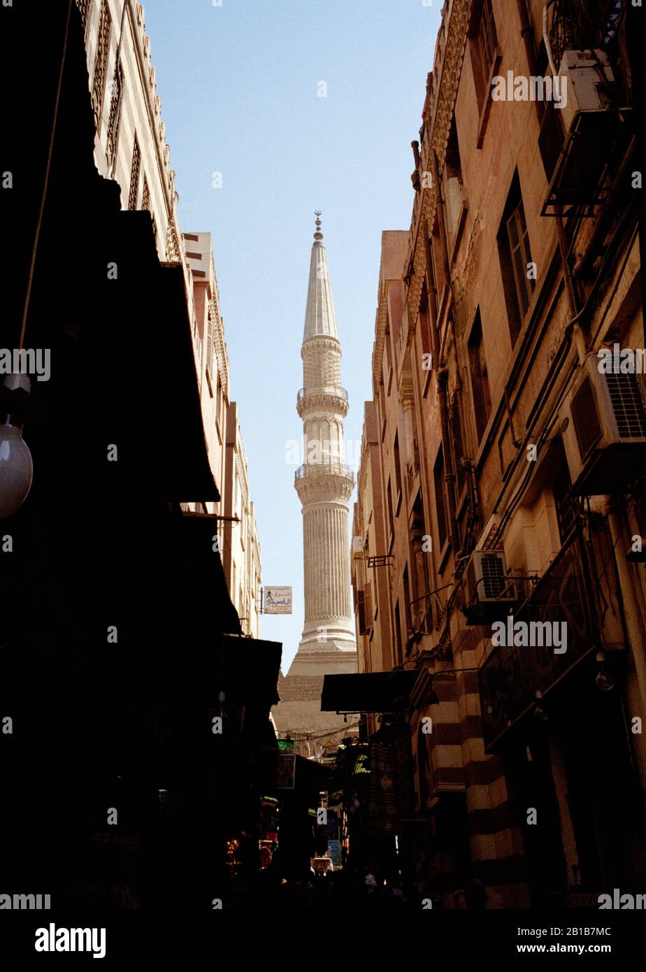 Minaret of Mosque Sayyidna Al Hussein in bazaar Khan Al Khalili in Islamic Cairo in Cairo in Egypt in North Afriica. El Stock Photo