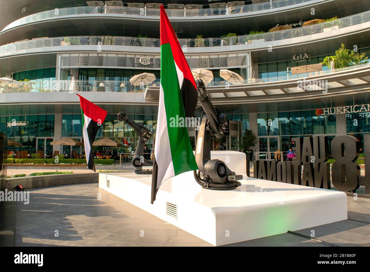 Dubai / UAE - December 3, 2019: UAE national flags in front of Dubai Mall. UAE National day. Flag day. Stock Photo