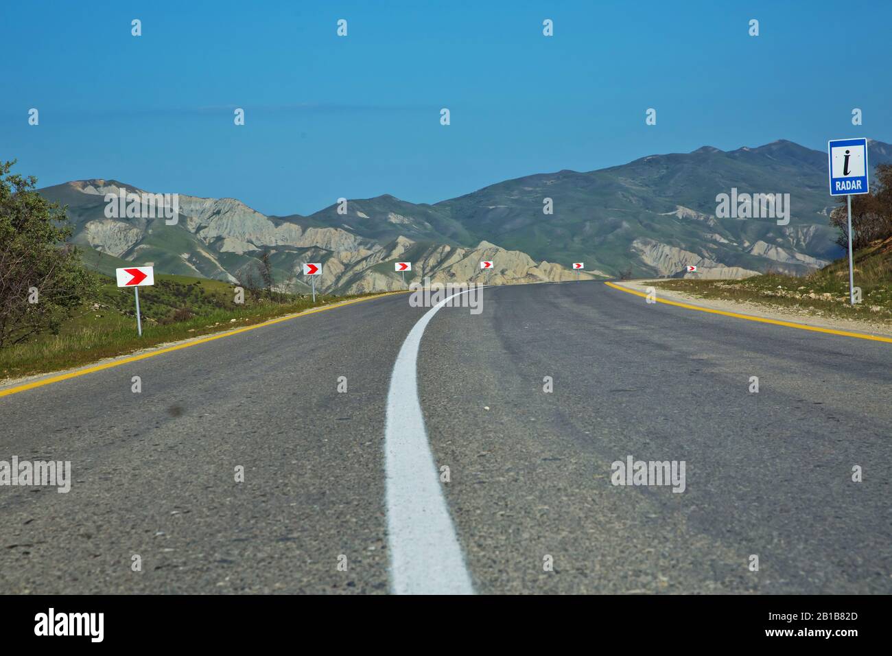 Winding country road in mountains . Asphalt road in the mountains with ...