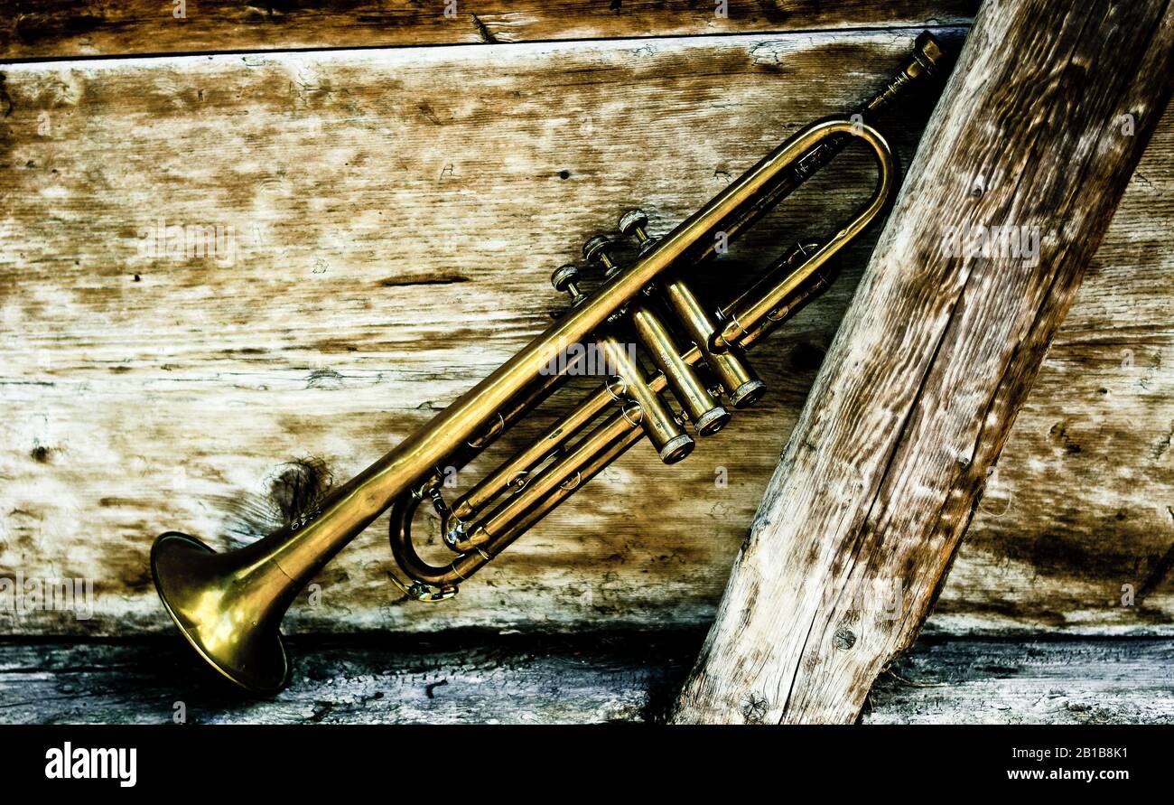 an old trumpet in an old background Stock Photo - Alamy