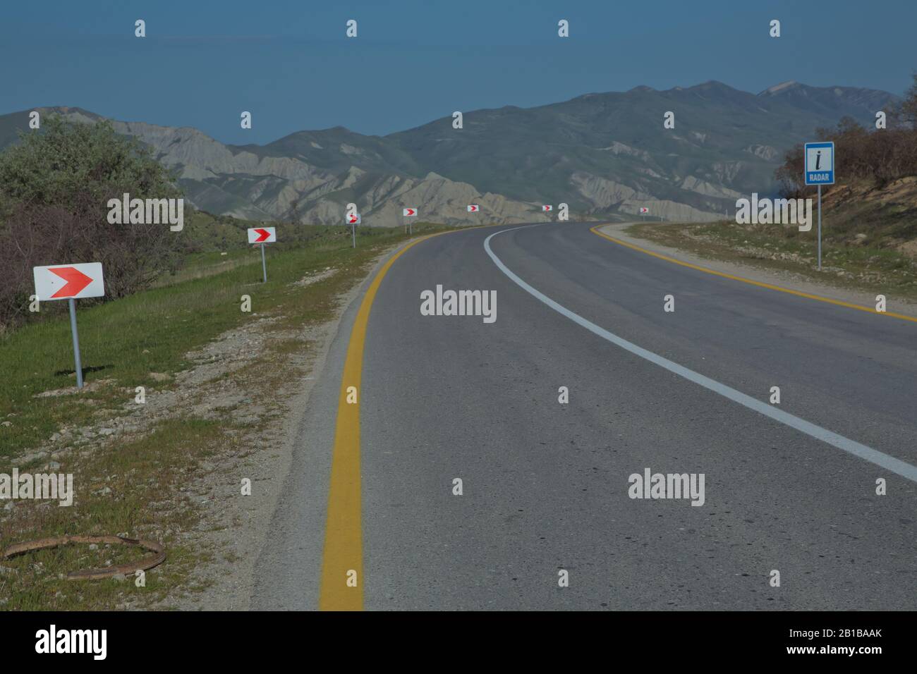 Winding country road in mountains . Asphalt road in the mountains with ...