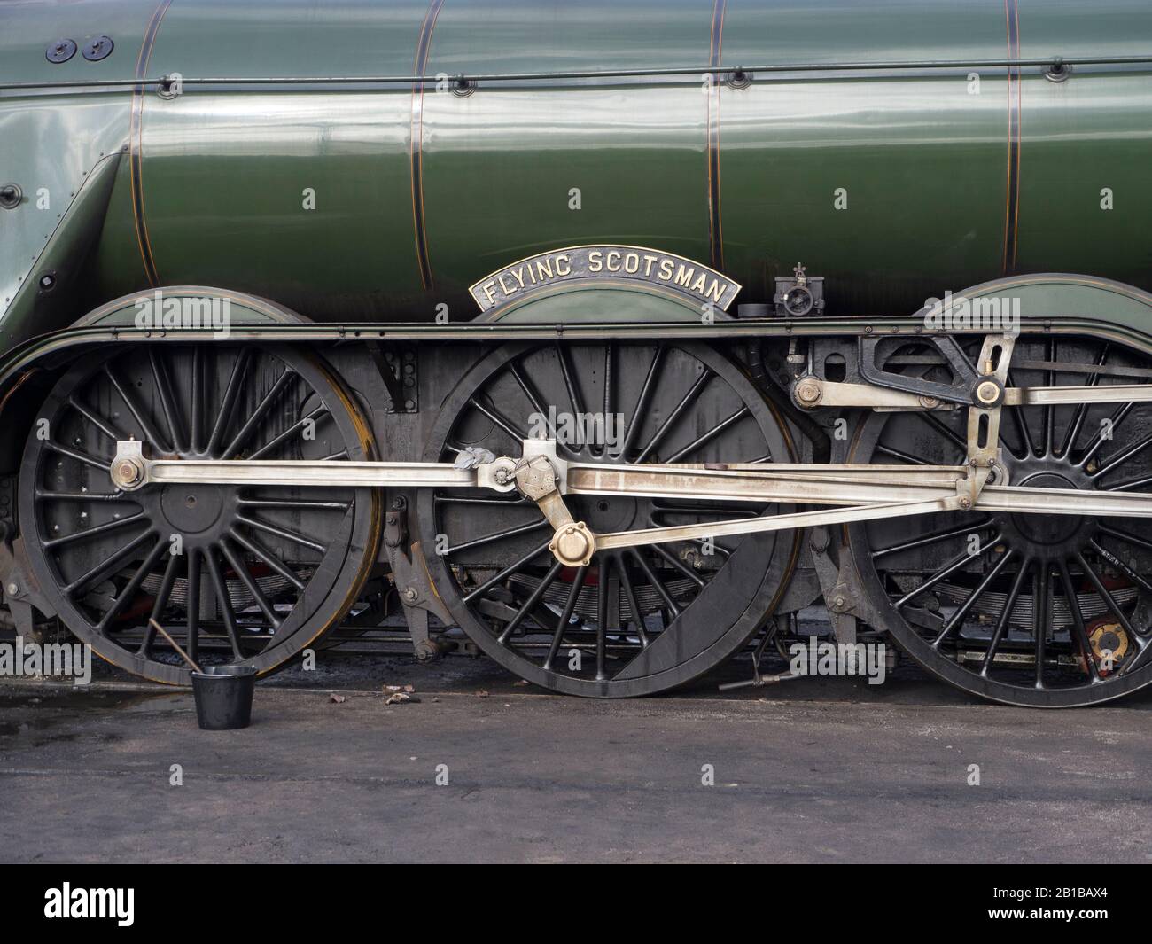 Flying Scotsman locomotive driving wheels and nameplate.Flying Scotsman is a Pacific steam locomotive built in 1923 for the LNER Stock Photo