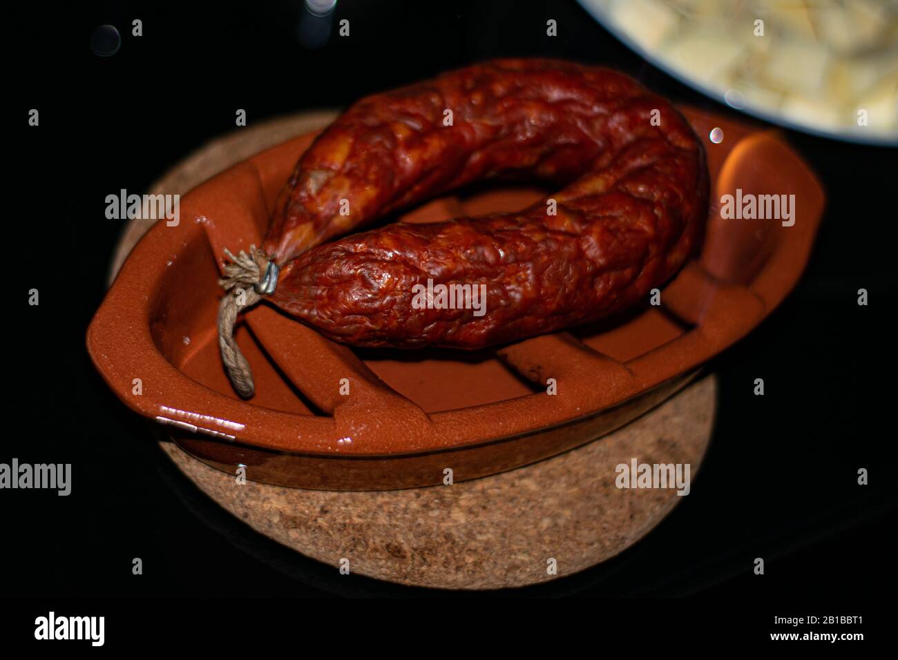 Grilled and simmered chorizon from portugal with aguardiente Stock Photo