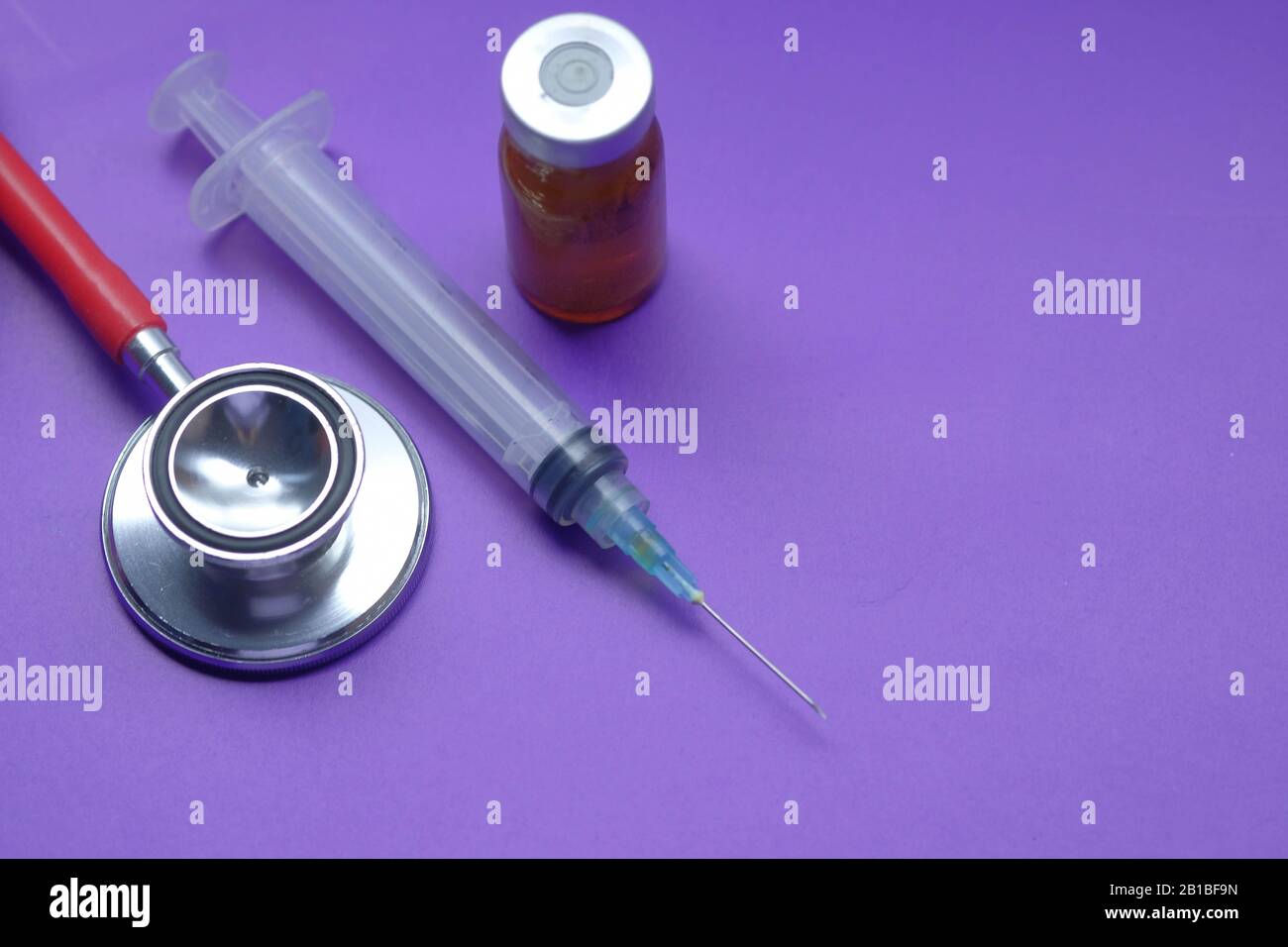 top view of stethoscope and syringe on color background Stock Photo - Alamy
