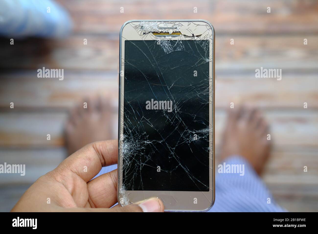 top view of person hand holding damage smart phone Stock Photo - Alamy top view of person hand holding damage smart phone Stock Photo - Alamy