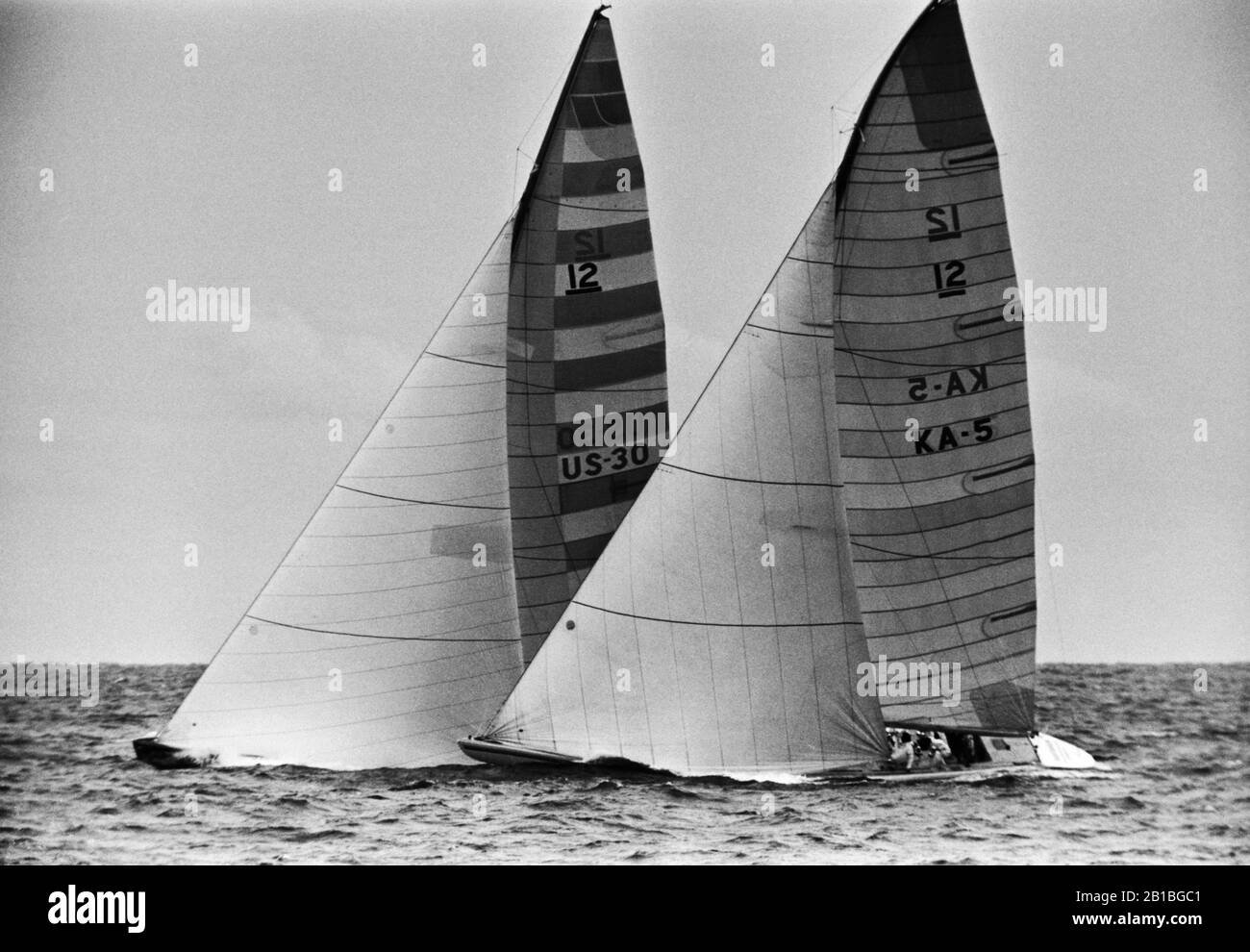 AJAXNETPHOTO. 26TH SEP 1980. NEWPORT, RHODE ISLAND, USA. - AMERICA'S CUP - FREEDOM (US-30) SKIPPERED BY DENNIS CONNER LEADS AUSTRALIA (KA-5)  AT THE START.  PHOTO:JONATHAN EASTLAND/AJAX REF:80926 9A Stock Photo