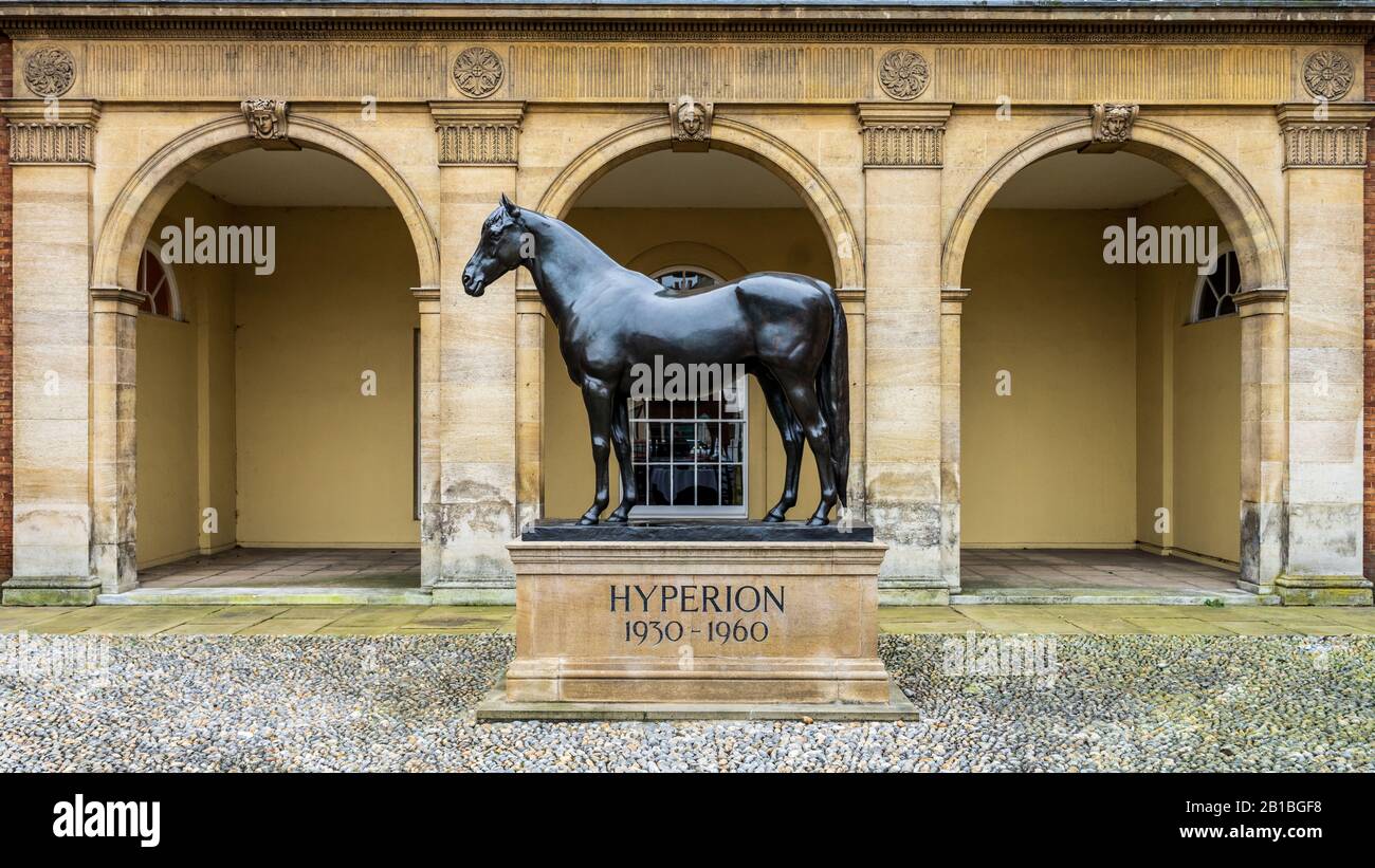 Jockey Club Newmarket - Front Facade of the Jockey Club Rooms in Newmarket Suffolk with a statue of Hyperion, a famous Newmarket horse. Stock Photo