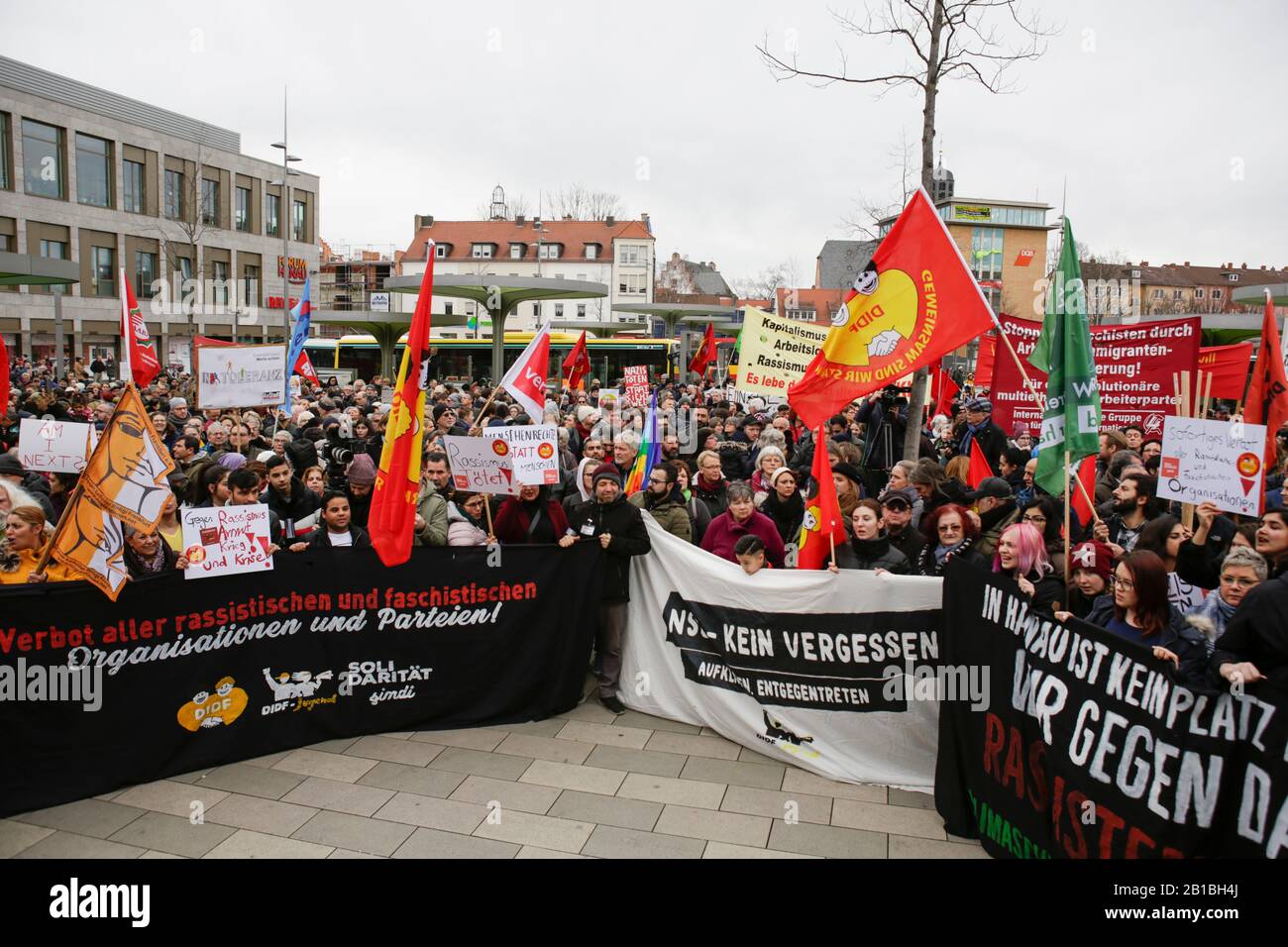 (2/22/2020) Protesters stand with flags and signs at the opening rally. Several thousand people marched through Hanau three days after the Hanau Shootings, to remember the victims and to protest against the rise in fascism and racism in Germany. (Photo by Michael Debets/Pacific Press/Sipa USA) Stock Photo