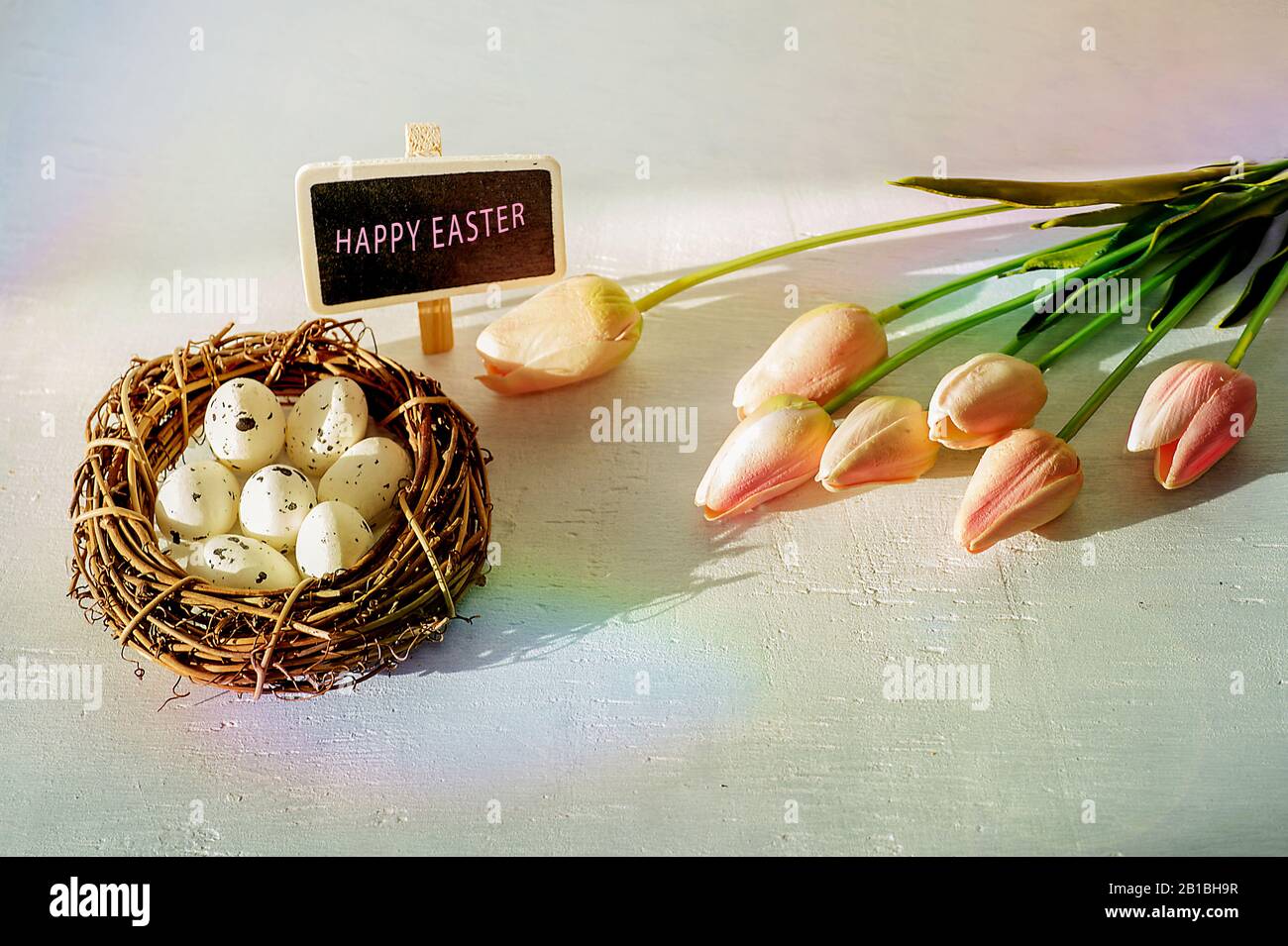 Easter eggs and tulips on wooden planks Stock Photo - Alamy