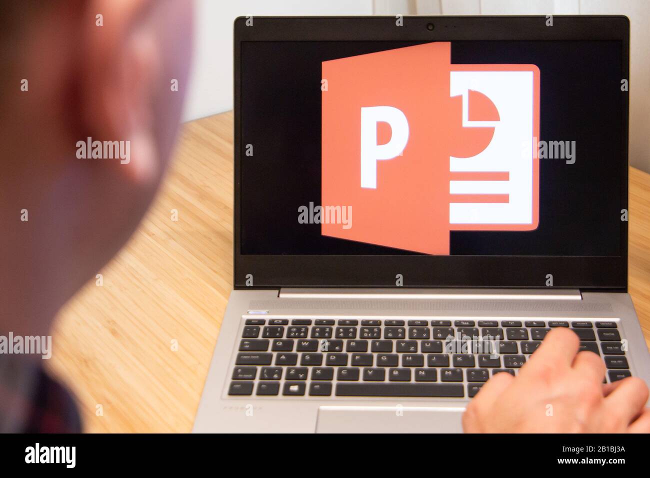 PowerPoint is used by a man on the laptop. Microsoft customer used computer software. New product is tested by IT specialist. San Francisco, February Stock Photo