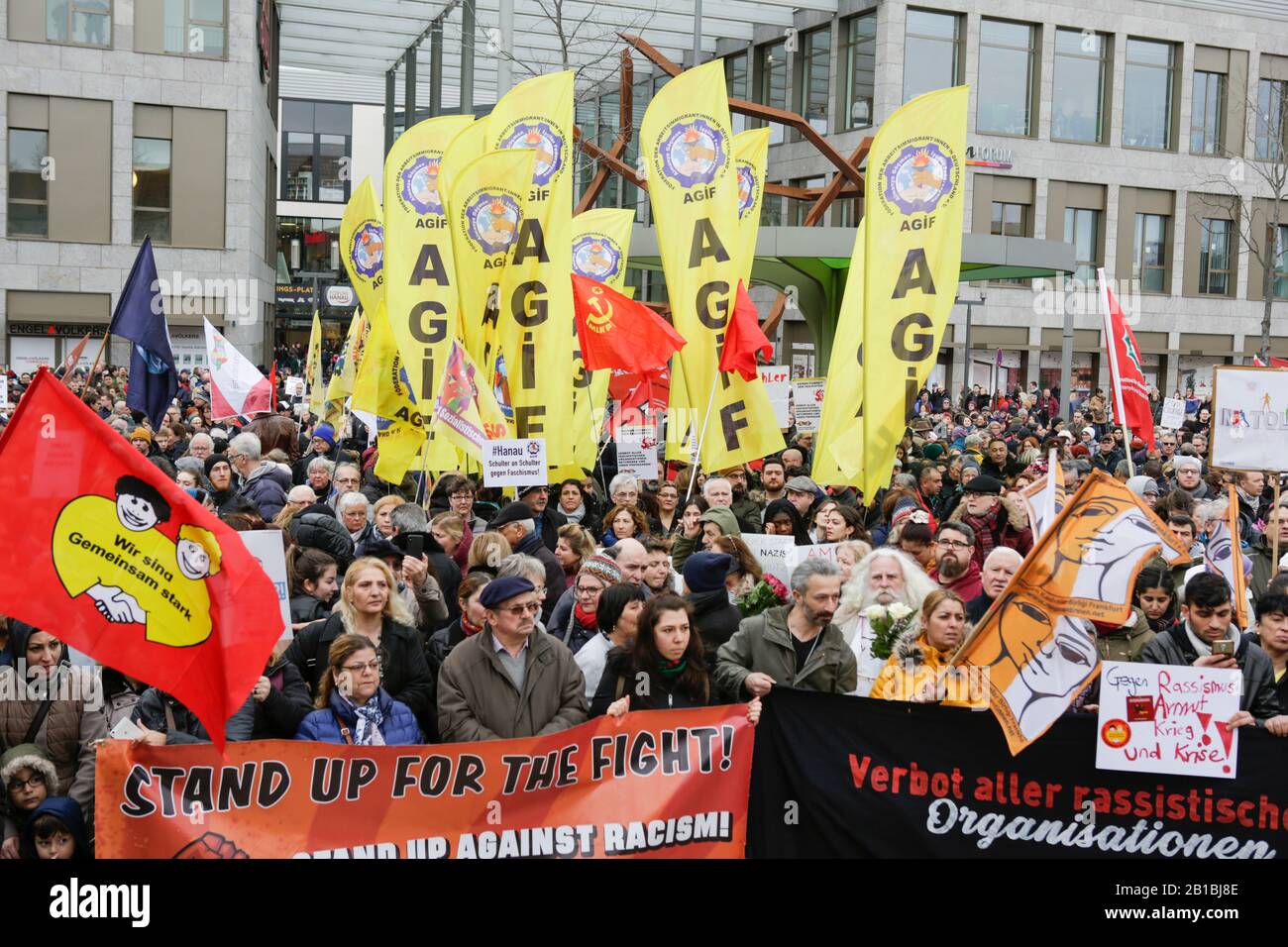 (2/22/2020) Protesters stand with flags and signs at the opening rally. Several thousand people marched through Hanau three days after the Hanau Shootings, to remember the victims and to protest against the rise in fascism and racism in Germany. (Photo by Michael Debets/Pacific Press/Sipa USA) Stock Photo