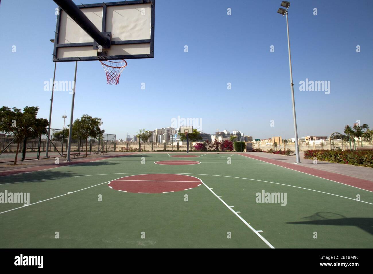 Dubai-Al Barsha Pond Park basket ball court white wing circle with top of the key back Stock Photo