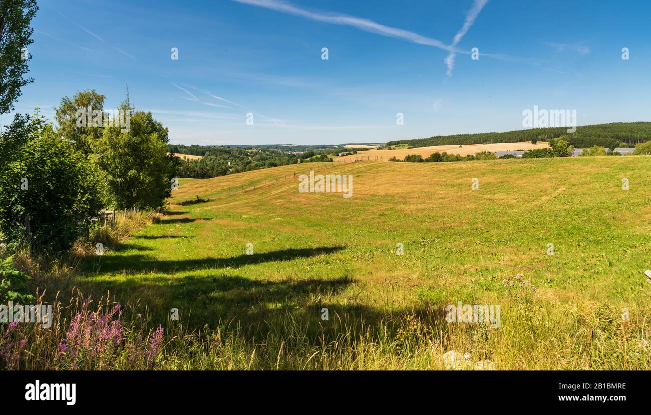 rolling landscape above Oelsnitz town in Vogtland region in Germany near borders with Czech republic Stock Photo