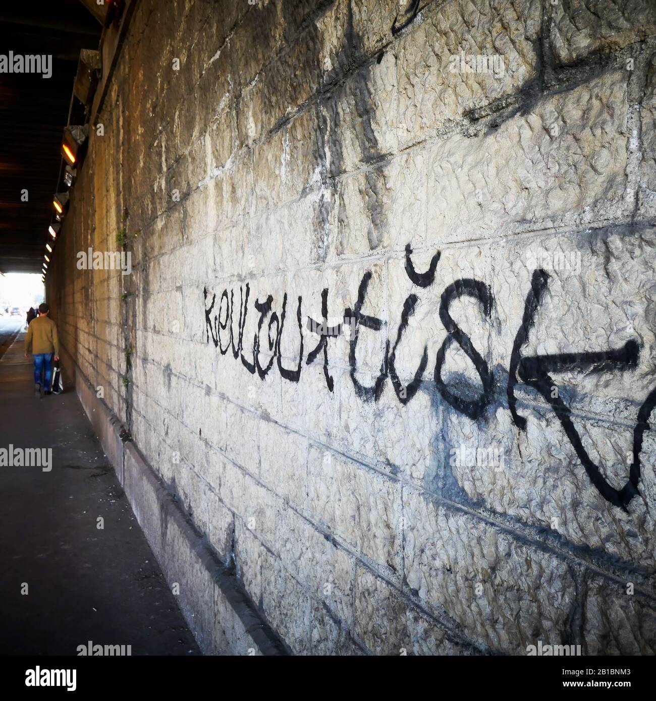 Stone wall with a graffiti, Lyon, France Stock Photo