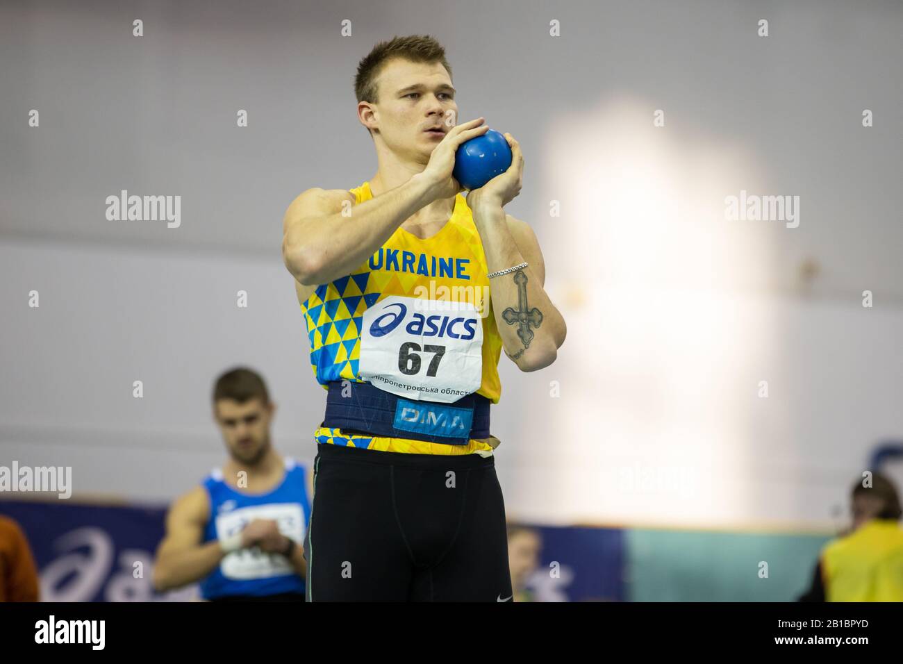 SUMY, UKRAINE - FEBRUARY 20, 2020: Ruslan Malohlovets -champion of Ukraine in heptathlon in shot put sector on Ukrainian indoor track and field champi Stock Photo