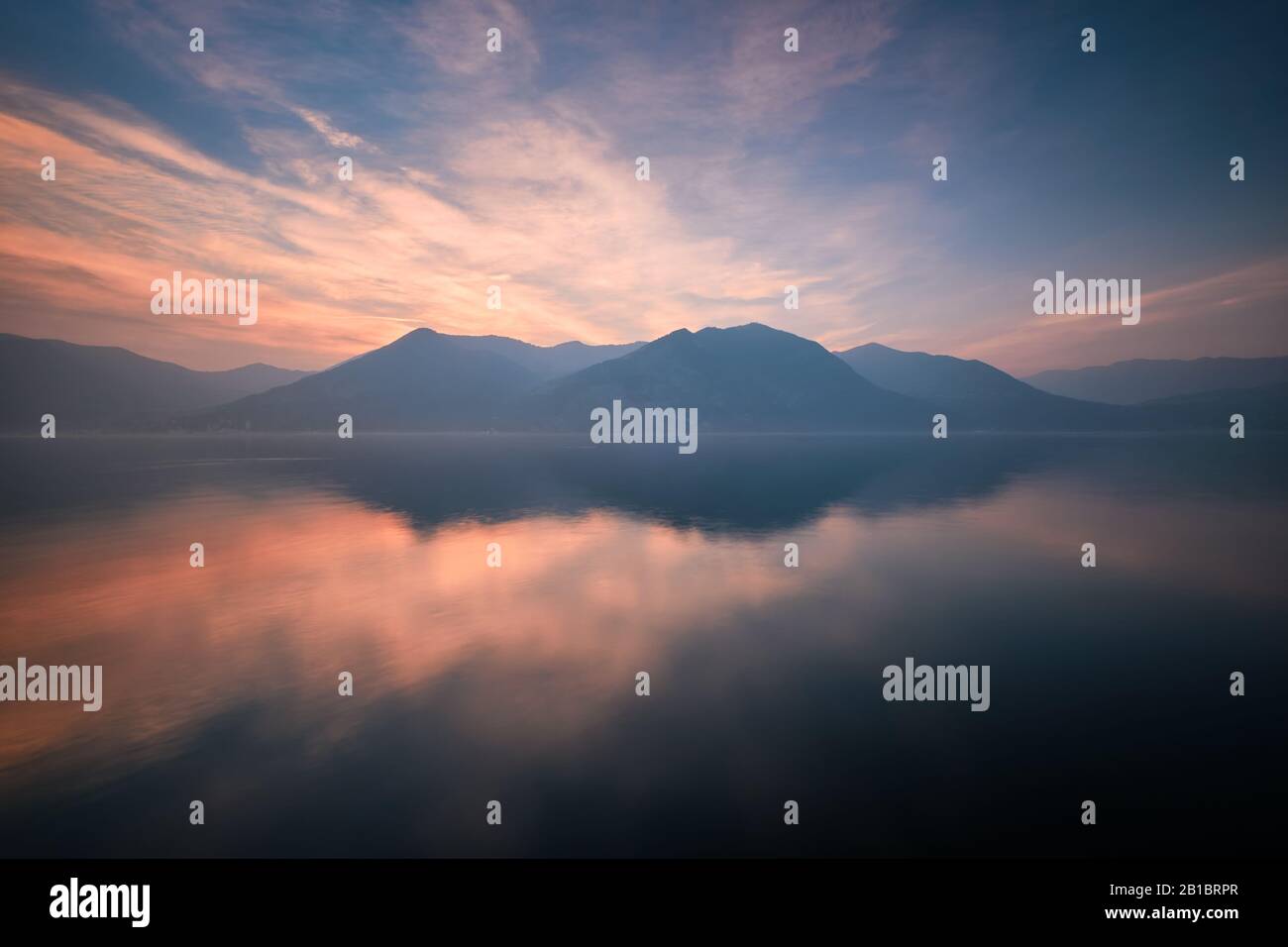Walking on air - Cloudscape reflections at Lago d'Iseo, Brescia, Italy Stock Photo
