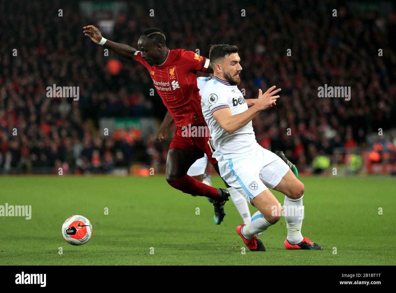 Liverpool's Sadio Mane (left) and West Ham United's Robert Snodgrass battle for the ball during the Premier League match at Anfield, Liverpool. Stock Photo