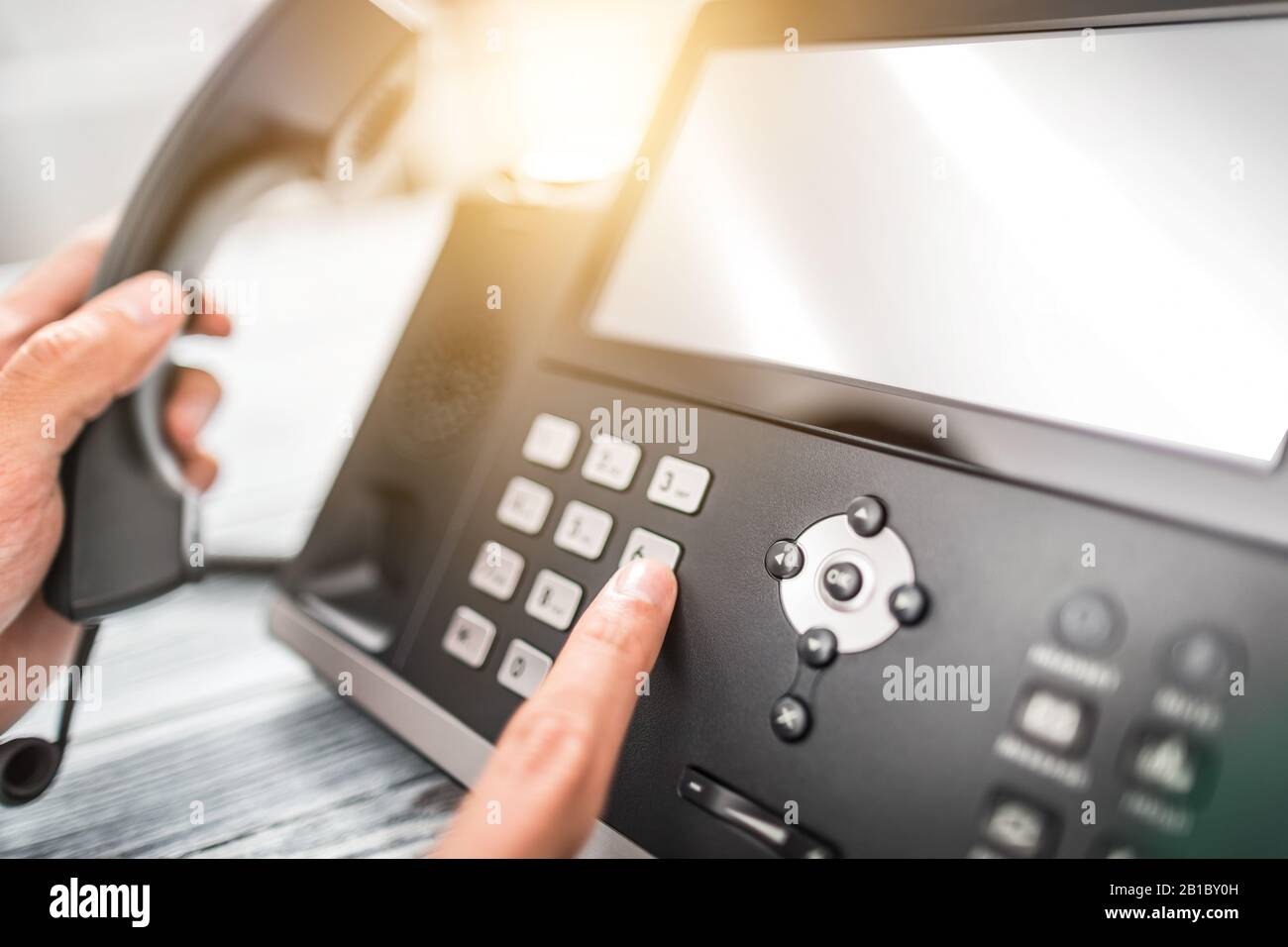 Communication support, call center and customer service help desk. Using a telephone keypad. Stock Photo