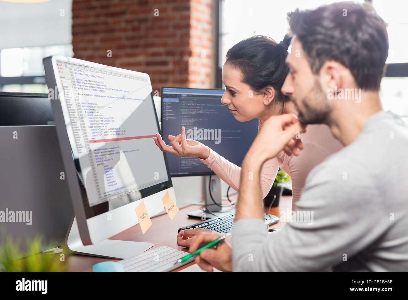 Developing programming and coding technologies. Website design. Programmer working in a software develop company office. Stock Photo