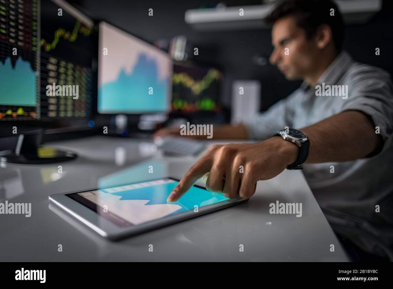 Analyzing data, graphs and reports for investment purposes. Developing new approaches. Stock Photo