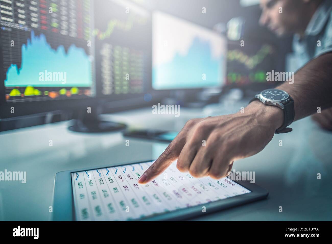 Analyzing data, graphs and reports for investment purposes. Developing new approaches. Stock Photo