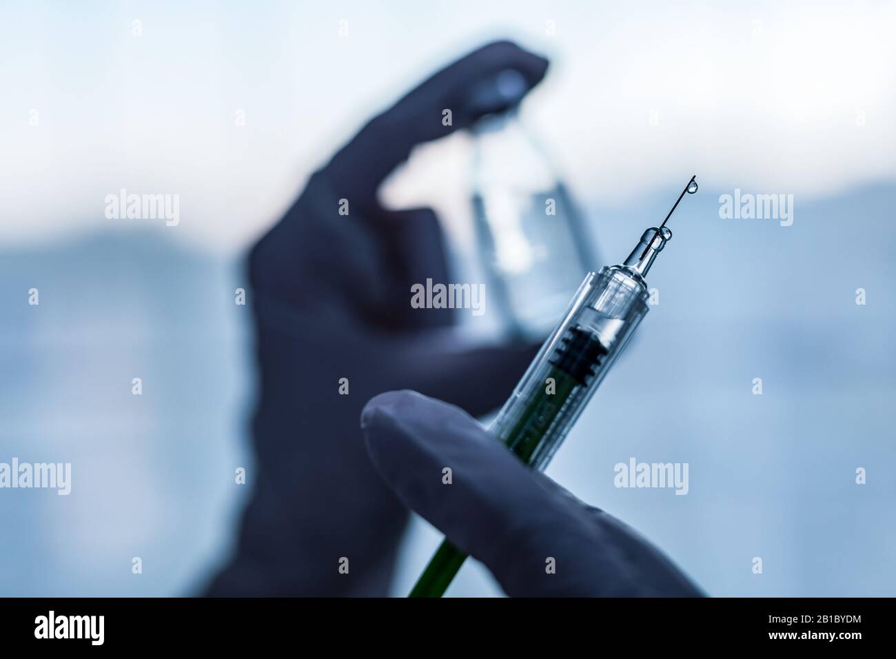 Syringe, medical injection in hand. Vaccination equipment with needle. Stock Photo