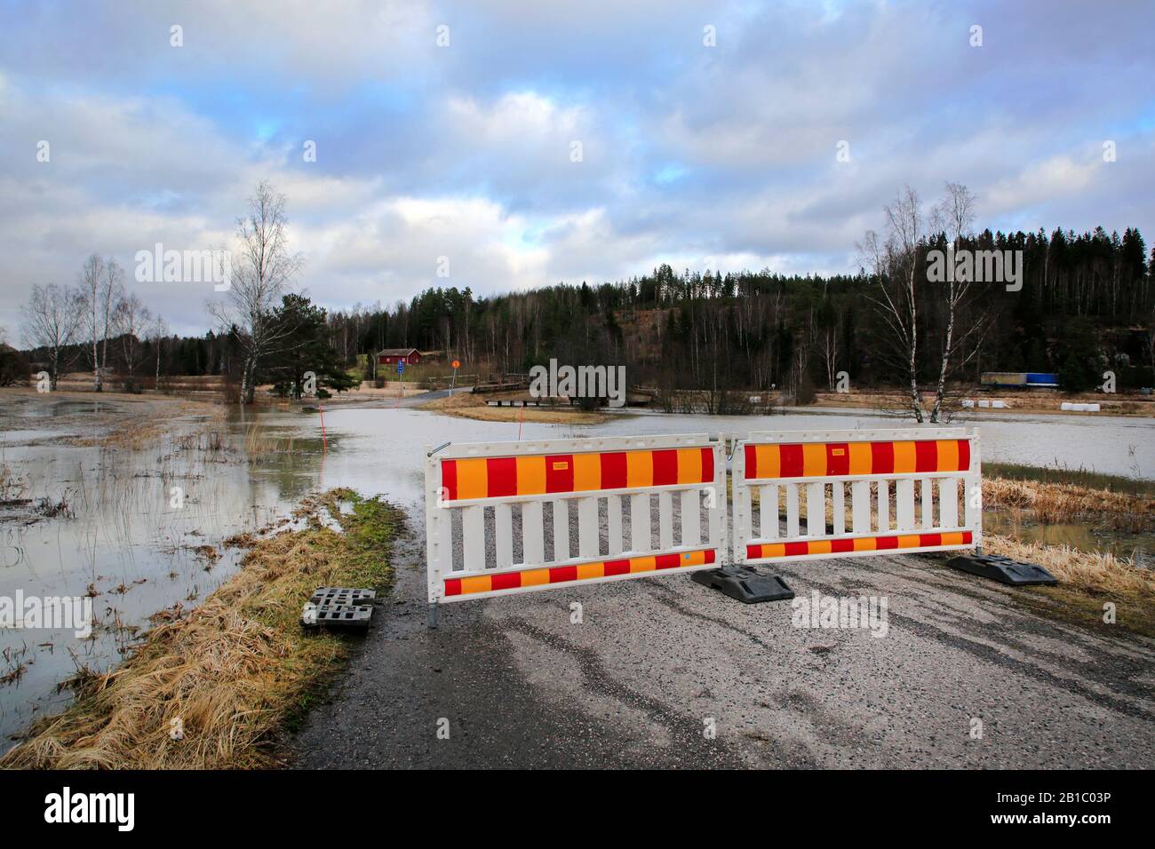 Small road off Highway 52 closed due to Perniönjoki river flooding in winter 2020. Perniö, Salo, Finland, February 23, 2020. Stock Photo
