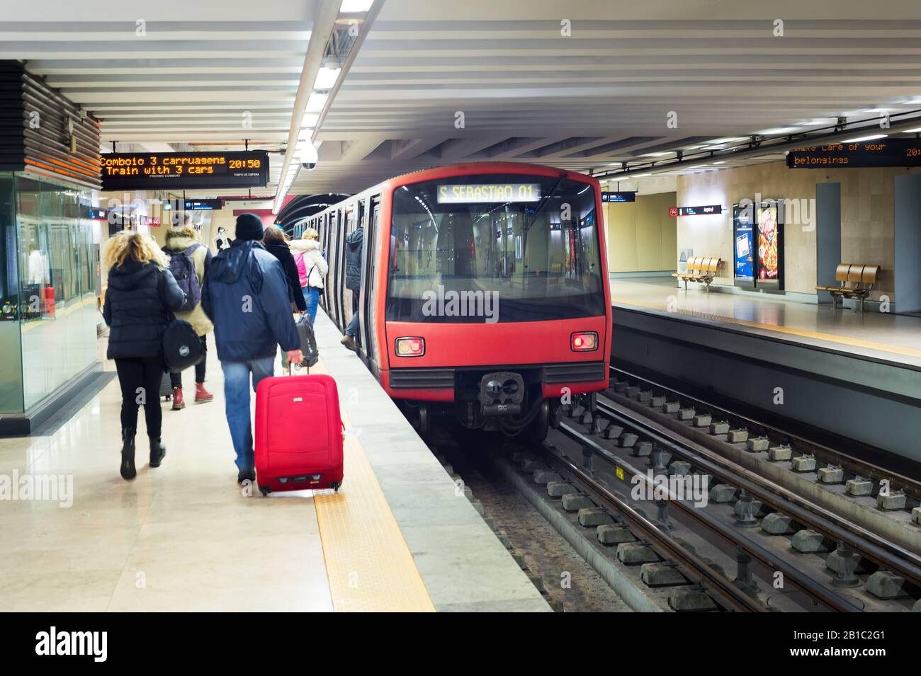 LISBON, PORTUGAL - JANUARY 28, 2020: People boarding subway train at Lisbon undeground subway staion. Stock Photo