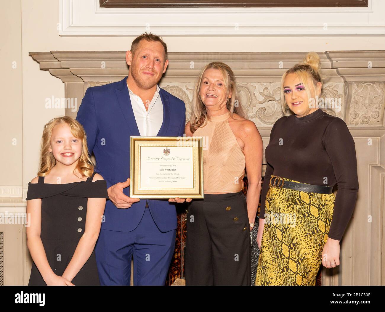 Warrington, UK. 24th Feb 2020. Ben Westwood with his certificate as Honorary Citizen of Warrington Town together with wife Debbie, and daughters Tyler and Gracie, Credit: John Hopkins/Alamy Live News Stock Photo