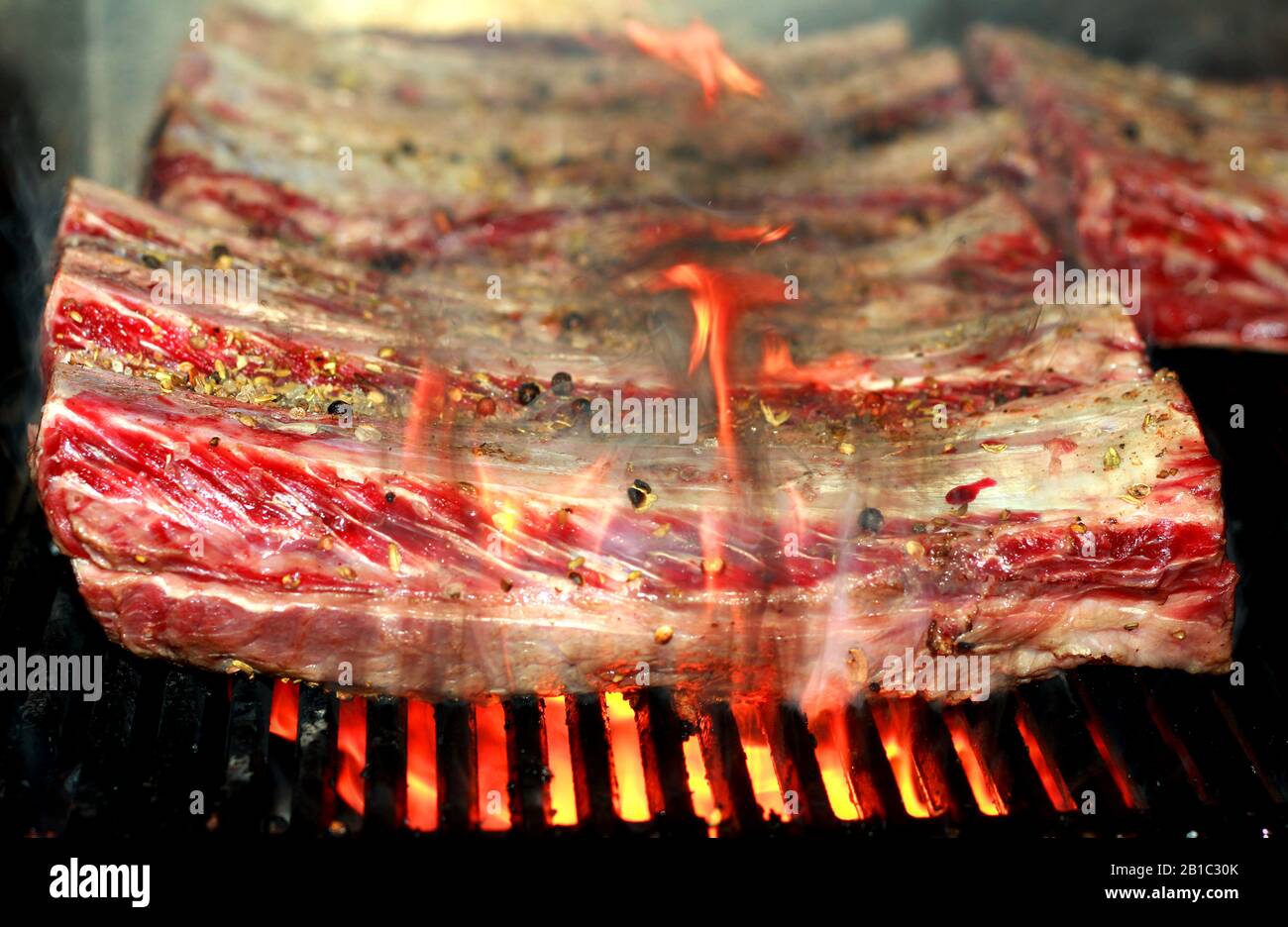 beef short ribs on BBQ flame grill Stock Photo Alamy