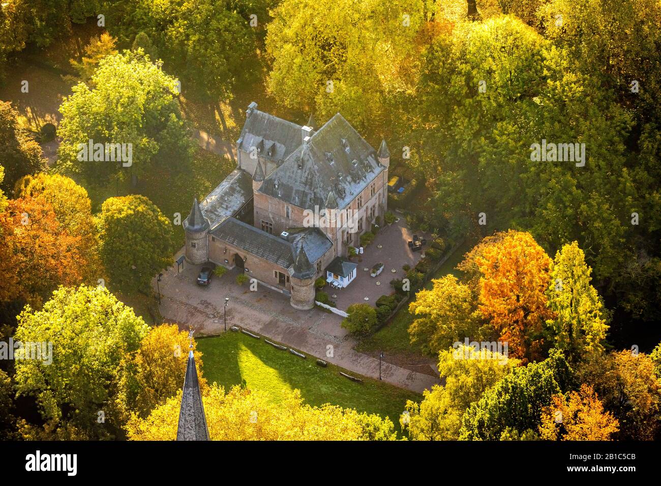 Aerial photograph, Restaurant Burg Ingenhoven in the autumnal forest, Lobberich district, Ingenhovenpark, Nettetal, Lower Rhine, North Rhine-Westphali Stock Photo