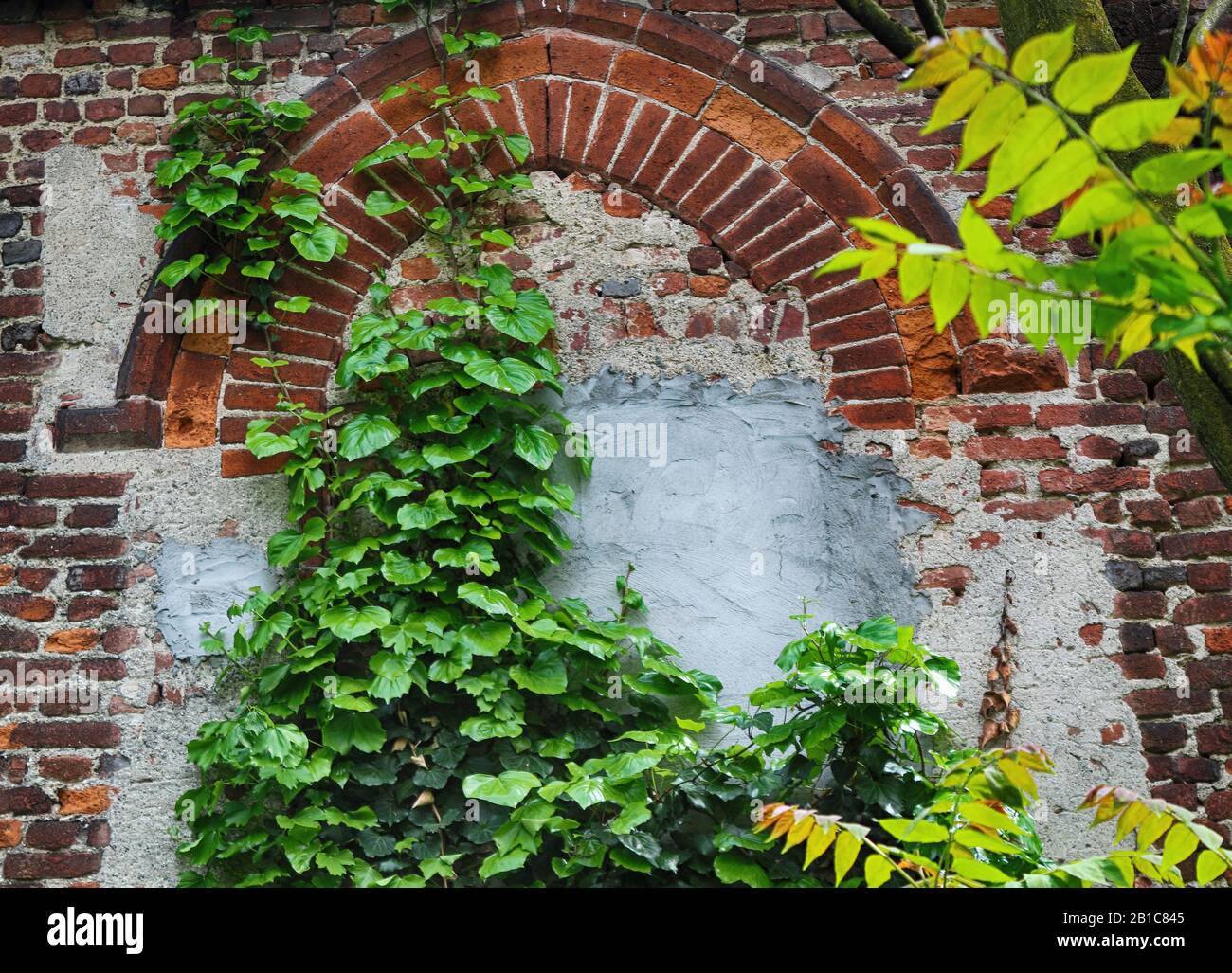 old brick wall with a closed window on old stone house Stock Photo - Alamy