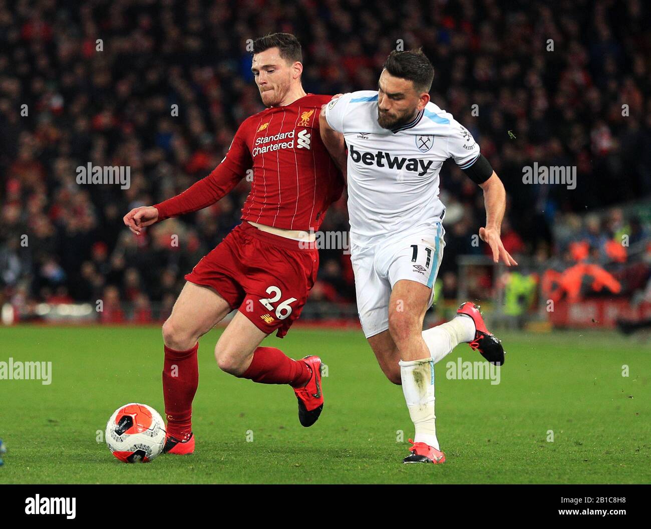 Liverpool's Andrew Robertson (left) and West Ham United's Robert Snodgrass battle for the ball during the Premier League match at Anfield, Liverpool. Stock Photo