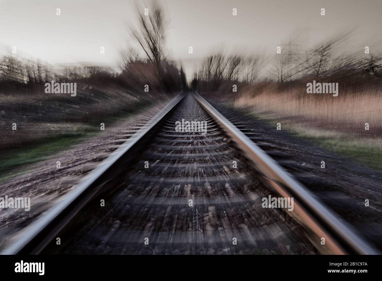 Railroad track with motion blur. High speed transportation concept and abstract nature Stock Photo