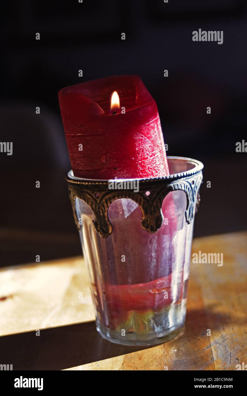 Candle in glass burning in the dark Stock Photo Alamy