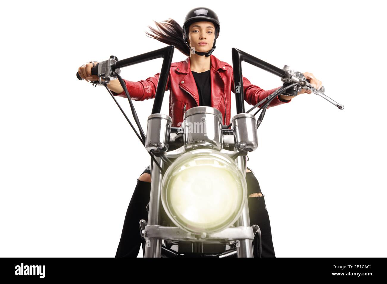 Portrait of a female biker riding a custom motorbike isolated on white background Stock Photo