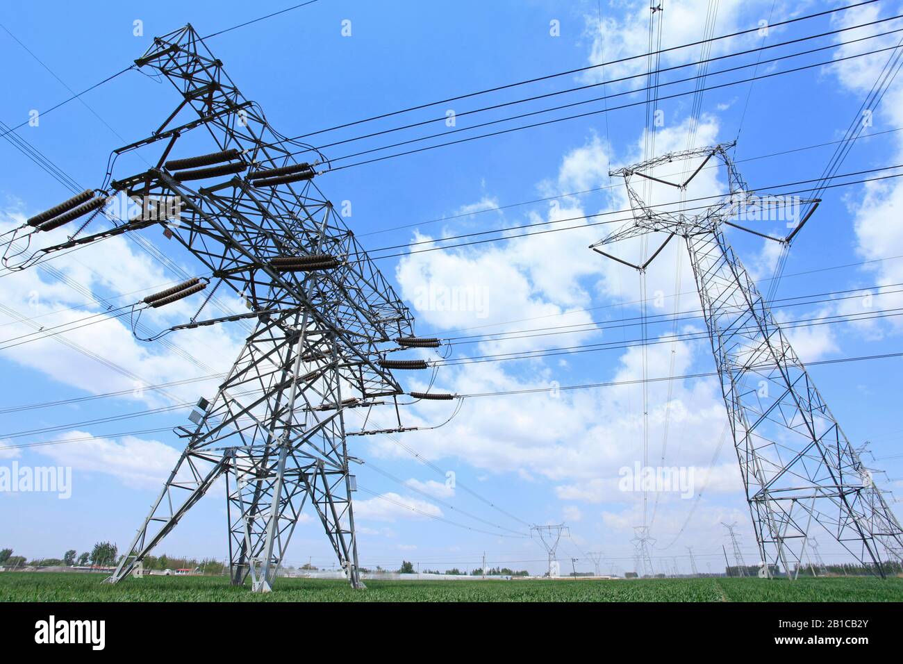 High voltage towers, under the blue sky white clouds, very beautiful ...