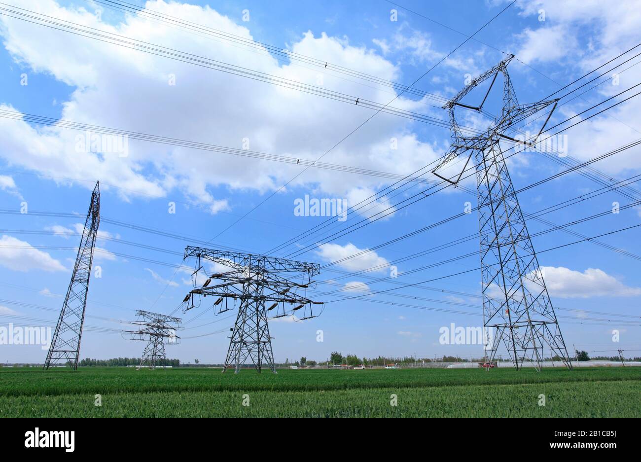 High voltage towers, under the blue sky white clouds, very beautiful ...
